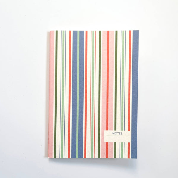 Notebook with multicolored striped design on a white background