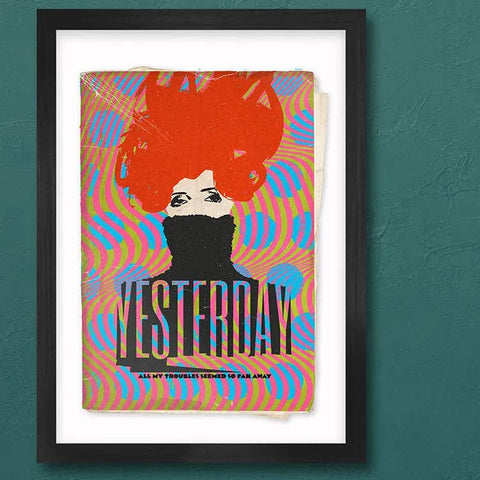 Framed artwork with colorful design on a teal wall above a record player.