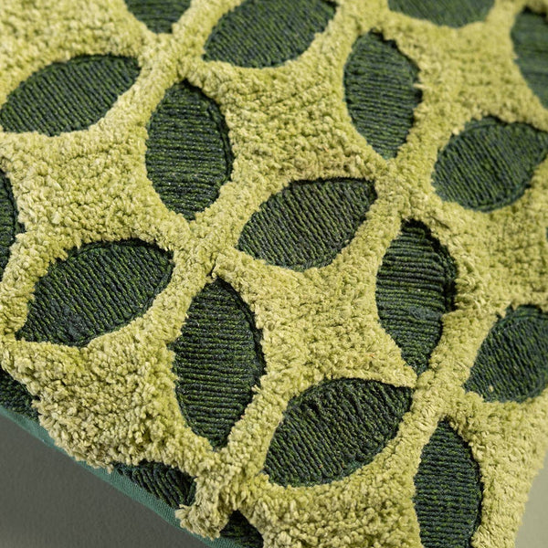 Close-up of green textured fabric with a geometric pattern