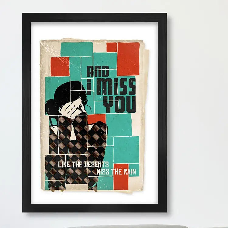 Framed poster with geometric design and text on a wall above a sofa.