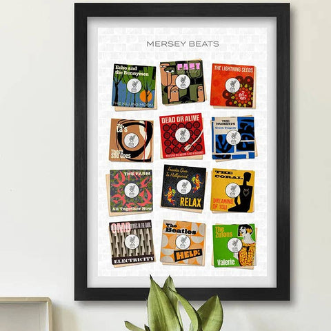 Framed poster of vintage record album covers titled 'Mersey Beats' on a wall with a plant and clock in the background.