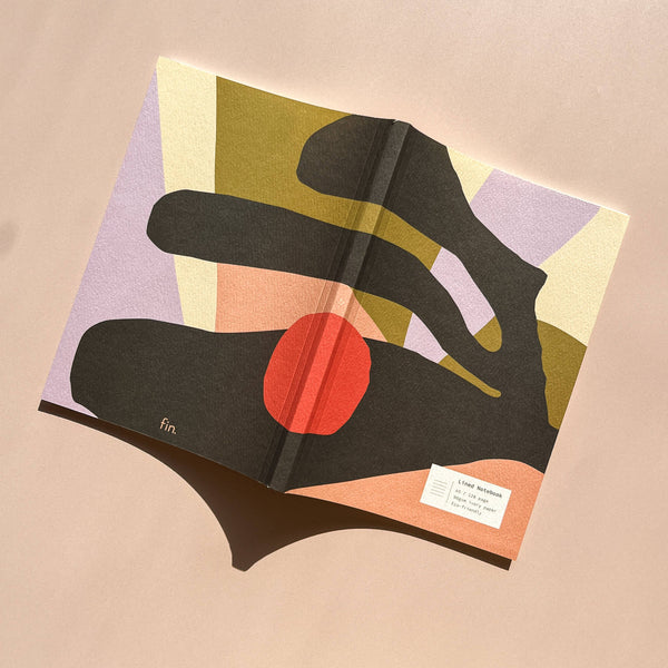 Book with abstract design on a beige background